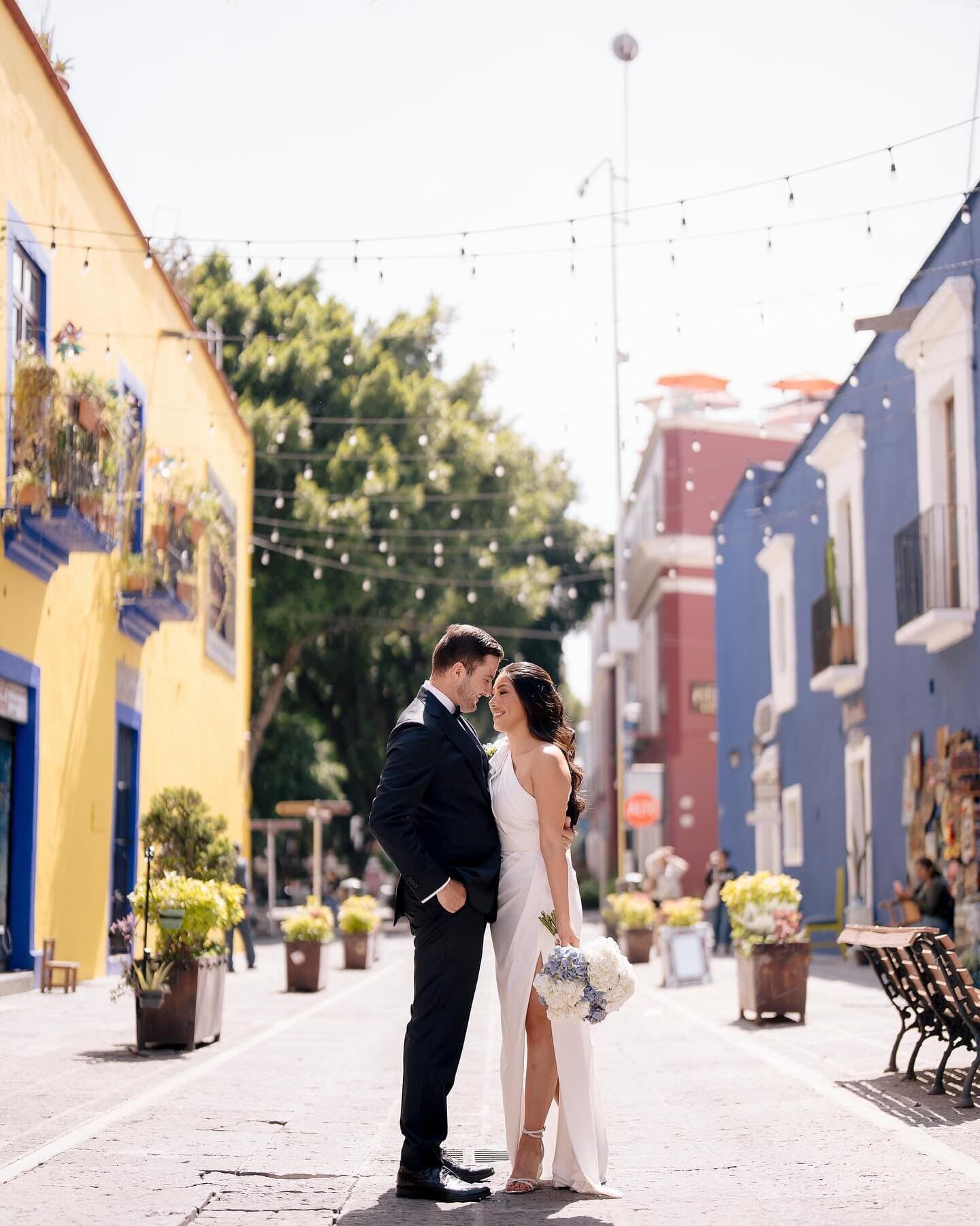 Bride with her bouquet beneath the stained-glass dome of a destination wedding venue